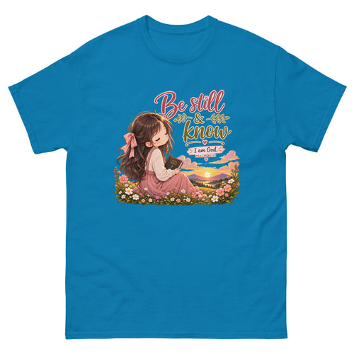 Chibi girl in a flower field holding a Bible with the words Be Still And Know on a Sapphire shirt