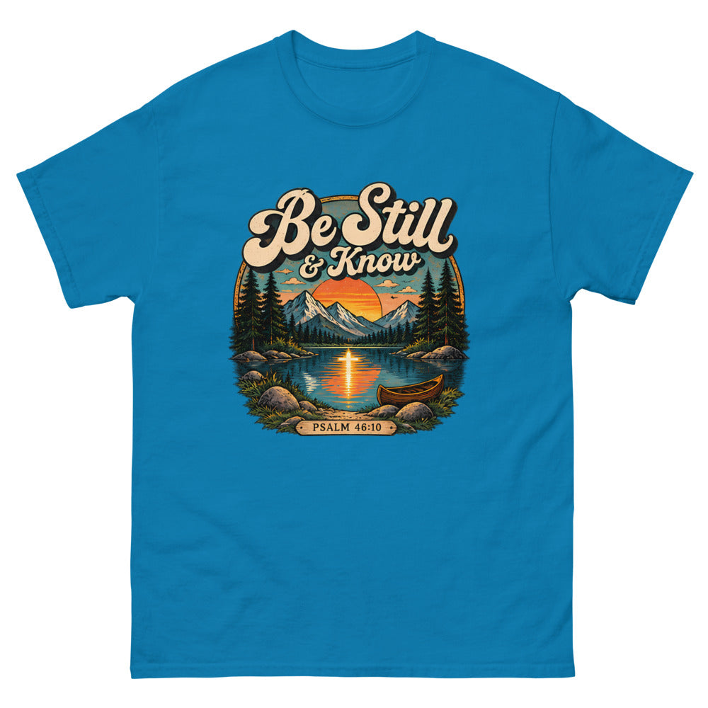 Retro lake and canoe scene at sunset reading Be Still And Know on a Sapphire shirt