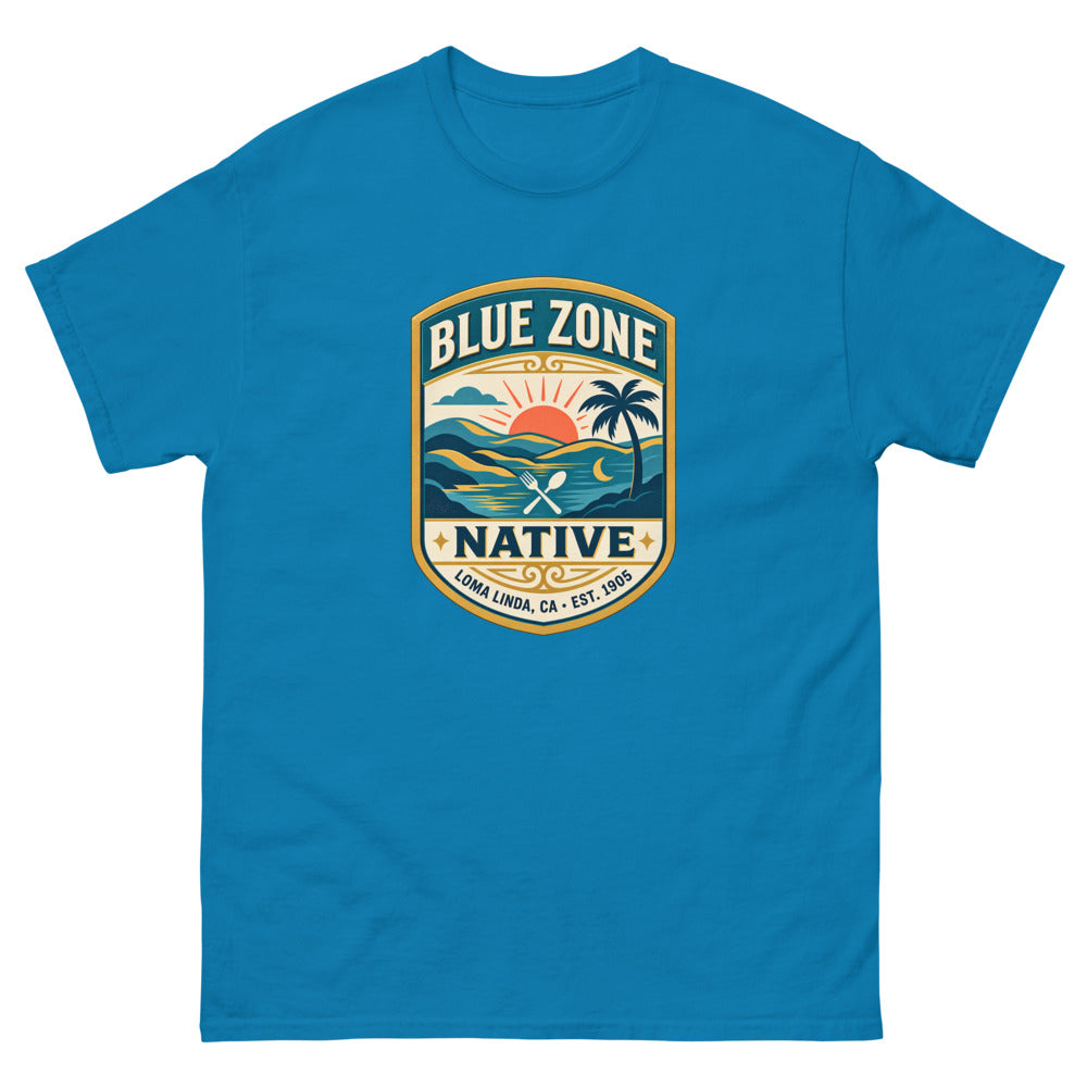 Vintage badge with a sunset and palm tree reading Blue Zone Native, Loma Linda CA on a Sapphire shirt
