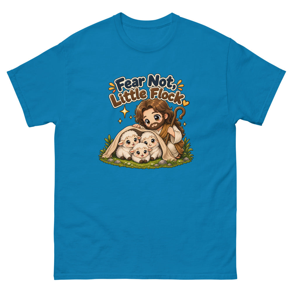 Chibi Jesus tucking a blanket around three sheep with the words Fear Not Little Flock on a Sapphire shirt