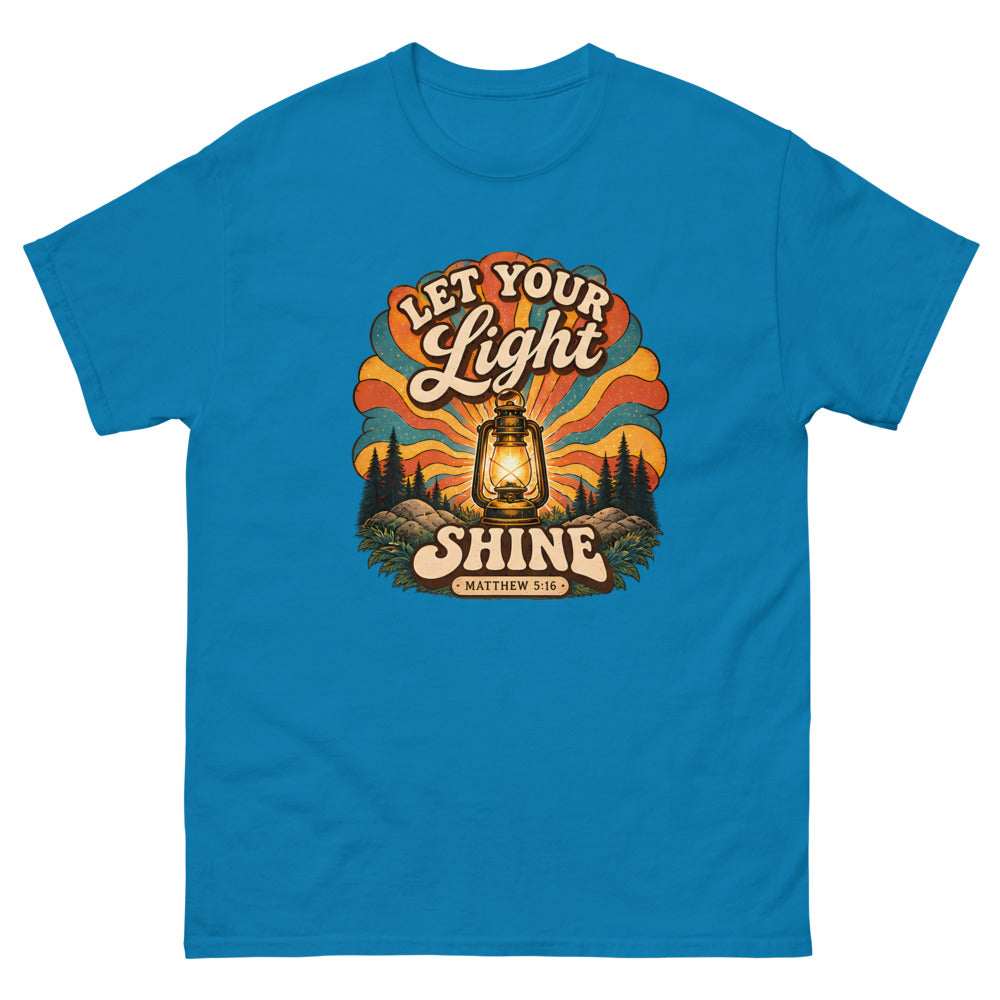 Retro lantern glowing against sunburst rays reading Let Your Light Shine on a Sapphire shirt