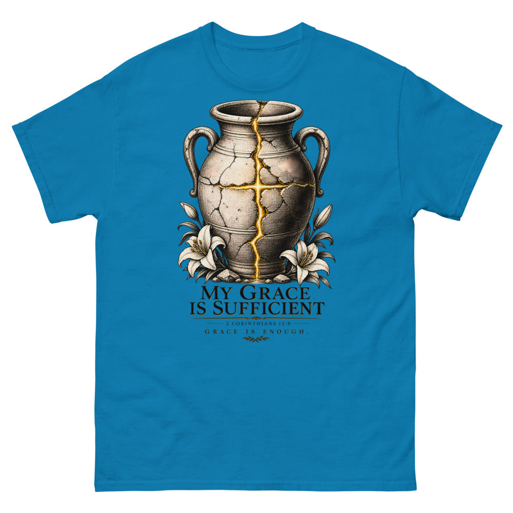 Cracked vessel repaired with gold seams forming a cross, reading My Grace Is Sufficient on a Sapphire shirt