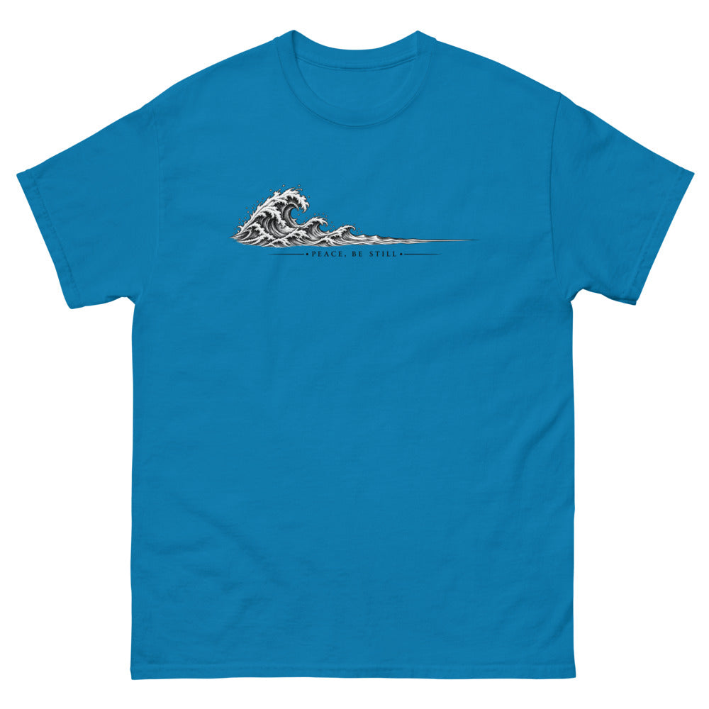 Engraved line art wave with the words Peace Be Still on a Sapphire shirt