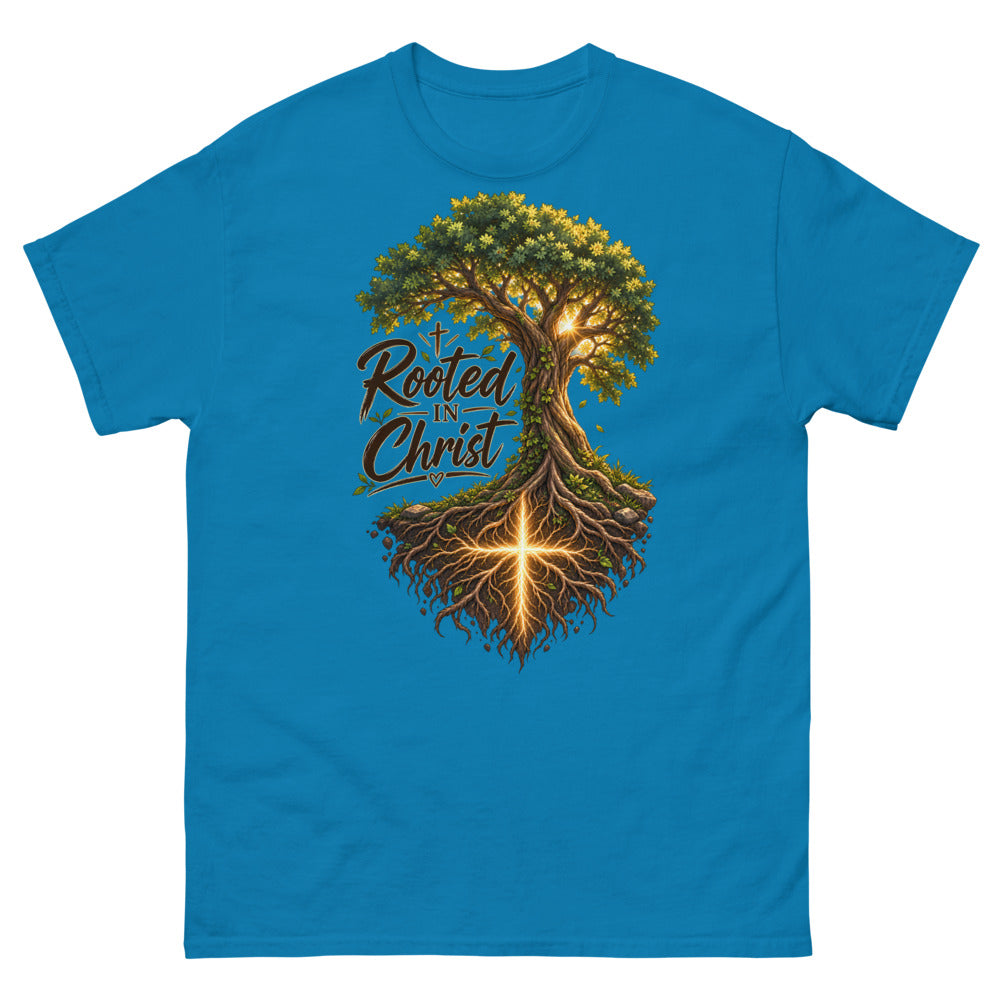 Detailed tree with a glowing cross in its roots and the words Rooted In Christ on a Sapphire shirt