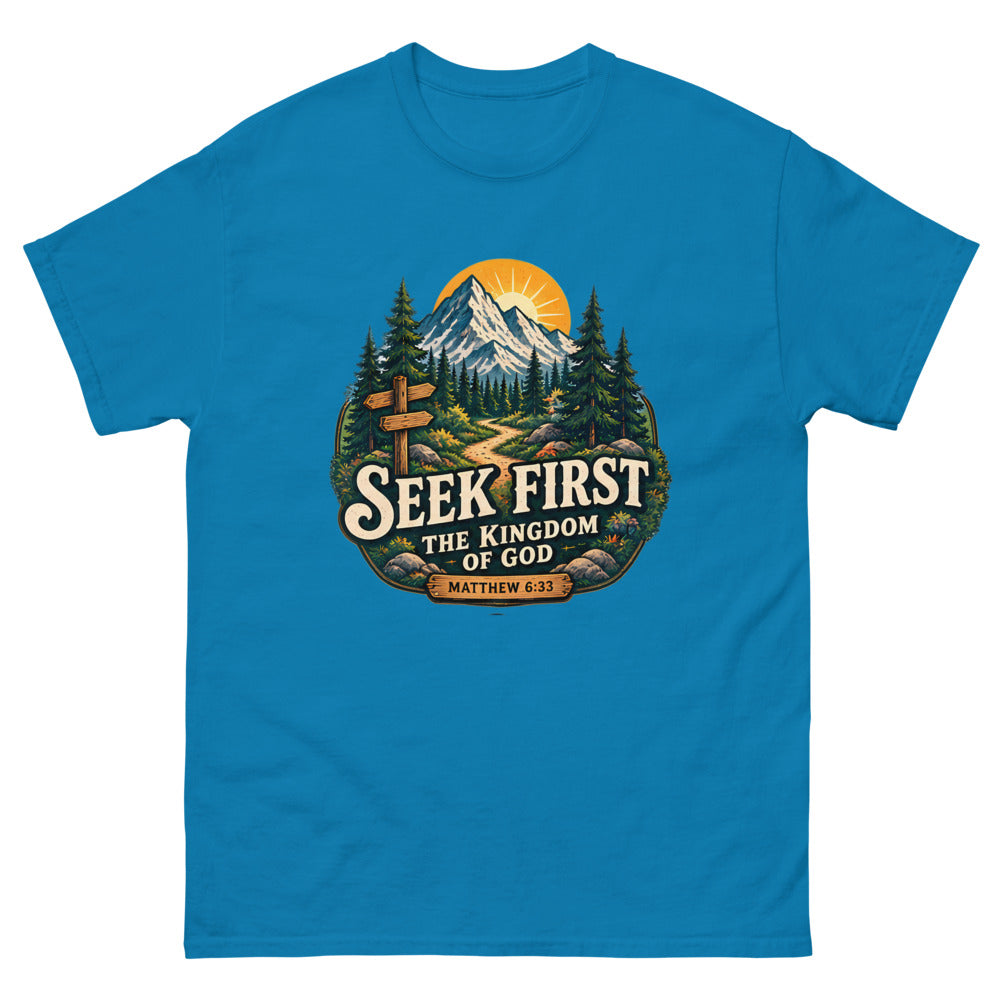 Vintage trail badge with mountains and a signpost reading Seek First The Kingdom Of God on a Sapphire shirt