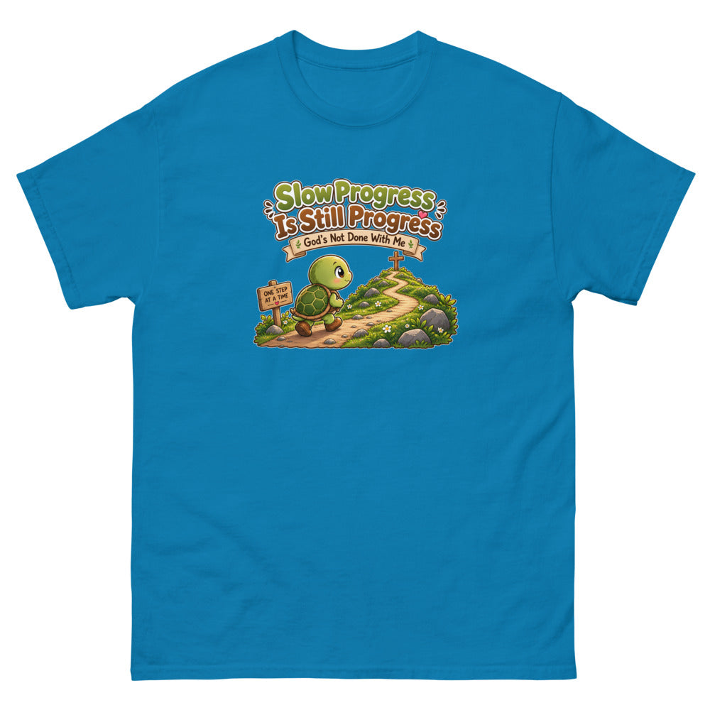 Cartoon turtle walking a path toward a cross with the words Slow Progress Is Still Progress on a Sapphire shirt