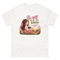 Chibi girl in a flower field holding a Bible with the words Be Still And Know