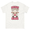 Cartoon lamb holding a heart with the words Jesus Loves Ewe