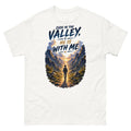 Hiker walking through a mountain valley with the words Even In The Valley He Is With Me